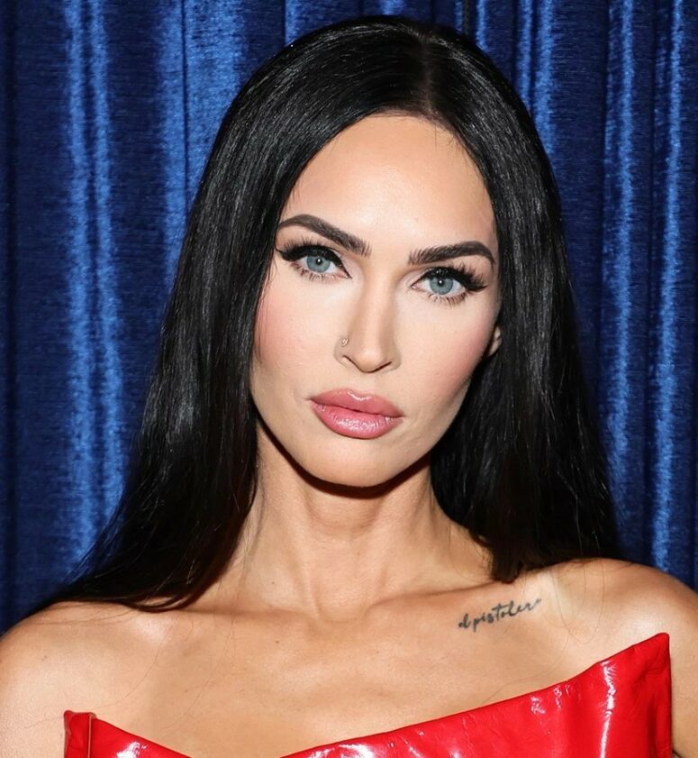 Megan Fox wearing perfect glossy brunette hair with side parting looks jaw-dropping