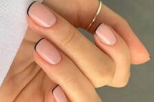 12 a super delicate and pretty barely there French manicure with nude nails and black tips