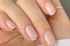 14 a delicate and modern micro French manicure with black and white micro tips is a very chic idea