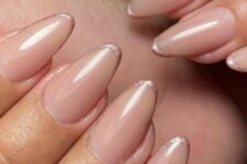 16 nude almond-shaped nails with rose gold micro tips are a delicate take on a French manicure