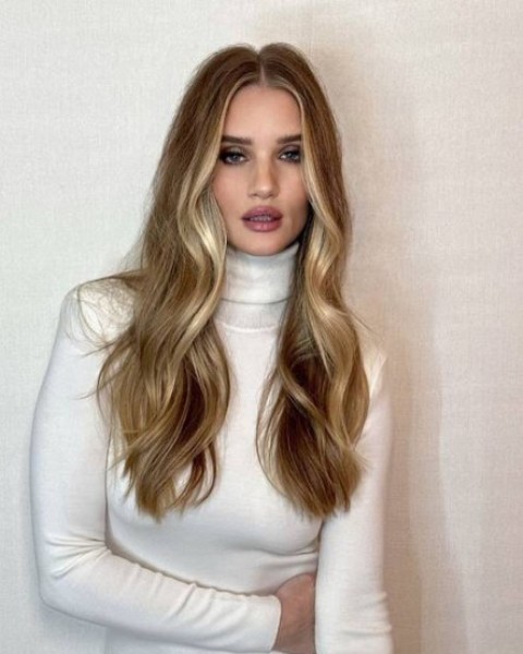Rosie Huntington-Whiteley wearing gorgeous long locks with a money piece - that's that expensive blonde