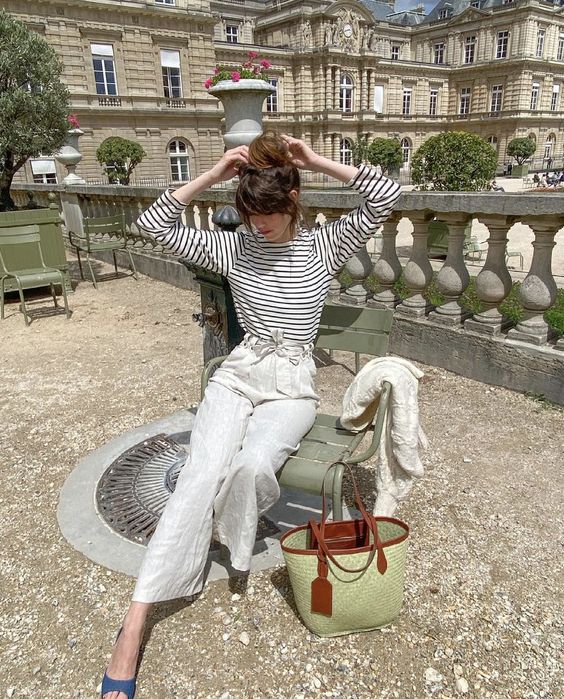 a Breton stripe top, white linen pants, blue peep toe shoes and a green straw bag for spring to summer time