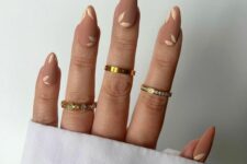 21 matte nude nails with neutral leafy detailing are a gorgeous idea for wearing right now