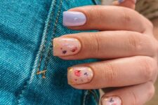 23 a nude and lilac manicure with nude nails accented with gold leaf and colorful dried blooms looks very spring-like