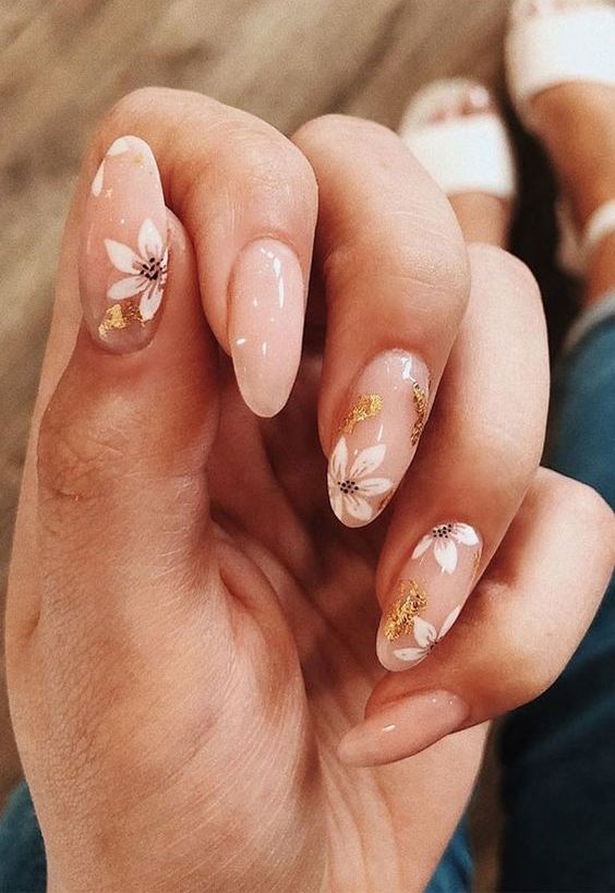 beautiful nude nails with a chic floral design and gold foil are an adorable solution for spring and summer