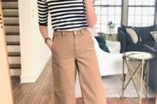30 tan wideleg pants, a striped top with short sleeves, white sneakers for a comfortable everyday look