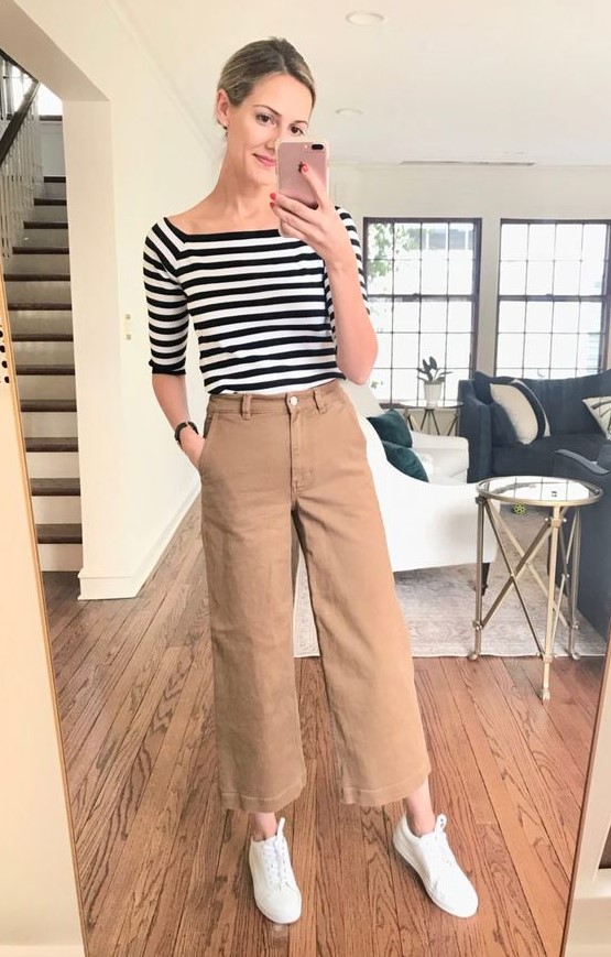 tan wideleg pants, a striped top with short sleeves, white sneakers for a comfortable everyday look