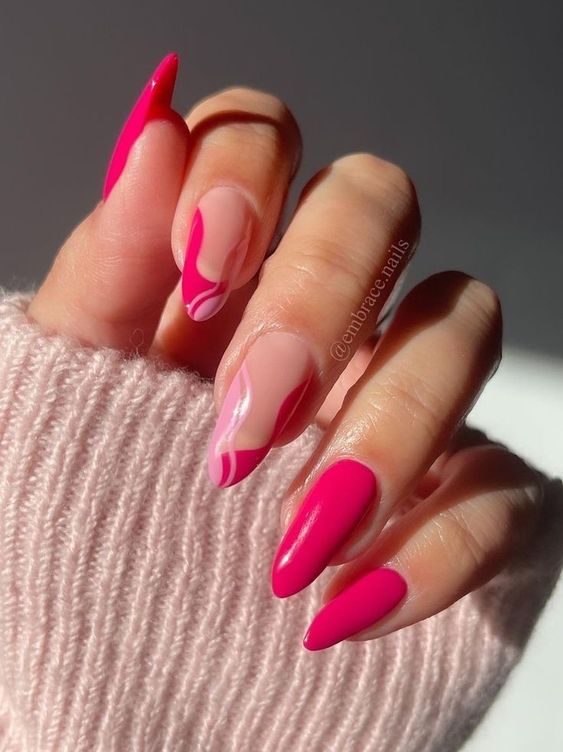an eye-catchy hot pink and nude manicure with interesting patterns and an almond shape are adorable