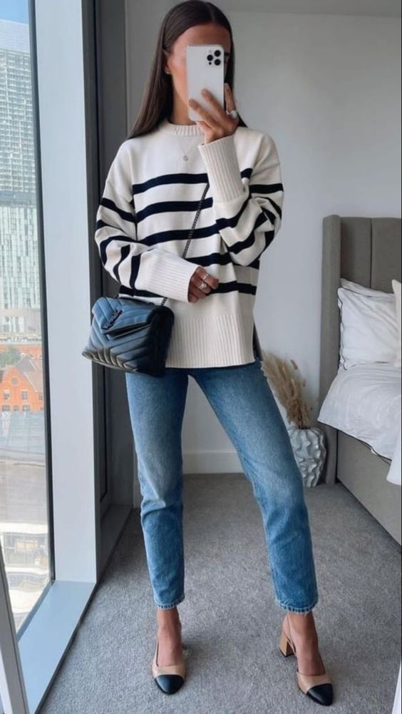 a Breton stripe jumper, blue cropped jeans, two-tone shoes, a black bag on chain are cool for spring
