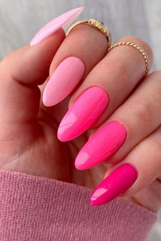 an ombre pink Barbiecore-themed manicure is a catchy idea if you love the color
