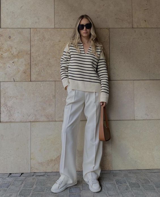a Breton stripe polo shirt, white palazzo pants, white sneakers and a brown bag are amazing for spring