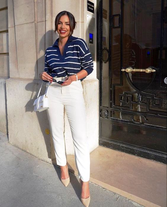 a navy Breton stripe polo shirt, white pants, nude shoes, a white bag for a chic and feminine look