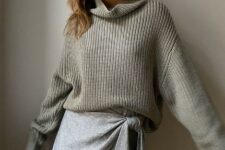 An outfit with a gray wrap mini skirt and a gray knitted loose turtleneck sweater