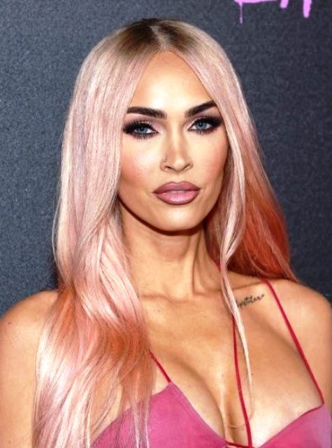 Megan Fox wearing peachy rose blonde long locks with central parting looks very cute and Barbie-style