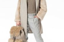 With beige baseball cap, beige coat, beige suede cutout ankle boots and beige faux fur backpack