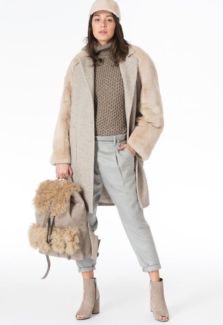 With beige baseball cap, beige coat, beige suede cutout ankle boots and beige faux fur backpack