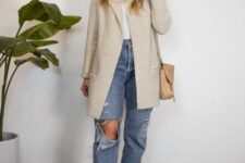 With beige collarless long jacket, beige leather bag and light brown leather ankle boots