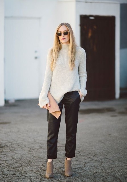 With brown framed sunglasses, pale pink suede clutch and gray suede heeled ankle boots