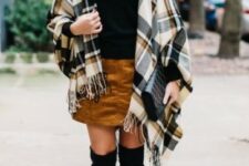 With brown, gray and white plaid scarf with a fringe, black leather embellished clutch and black suede over the knee boots