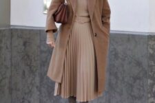 With brown midi coat, oversized sunglasses, brown leather bag and gray suede over the knee heeled boots