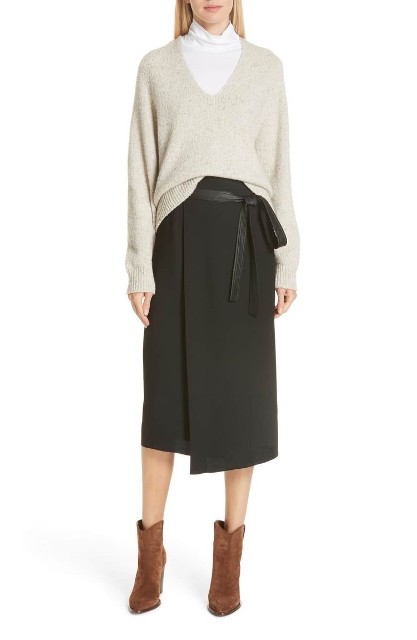 With light gray loose sweatshirt and brown suede mid calf heeled boots