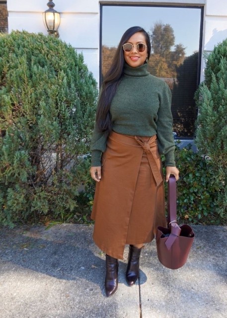 With rounded sunglasses, purple leather tote bag and dark brown leather mid calf boots