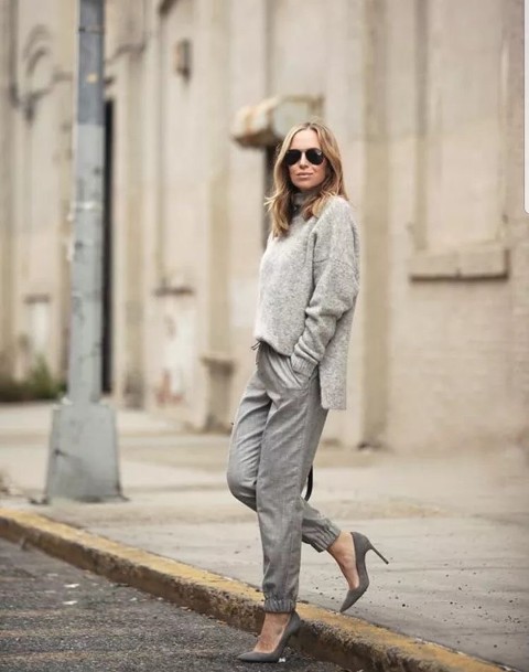 With sunglasses and gray pumps
