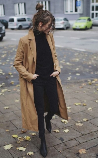 With sunglasses, black leather heeled boots and brown maxi trench coat