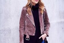 With sunglasses, pink suede jacket and black leather bag