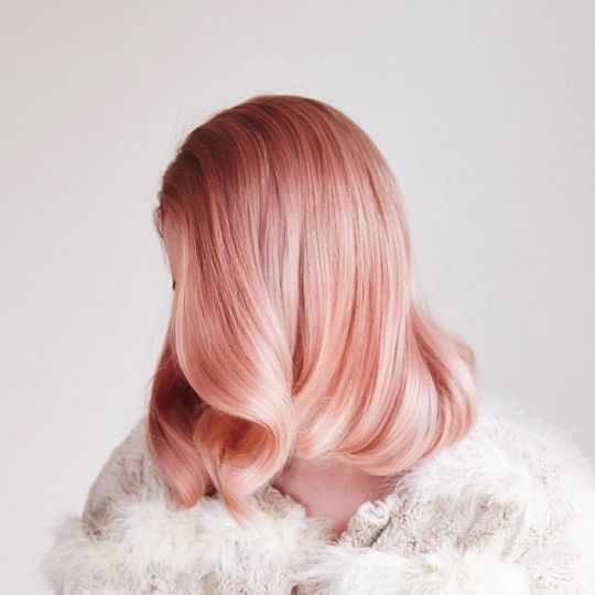 a beautiful peachy rose gold long bob with side parting and wavy soft waves on the ends plus naturla shine is wow