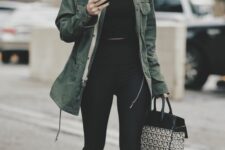 a black crop top and leggings, grey trainers, a green utility jacket and a printed bag are great for spring