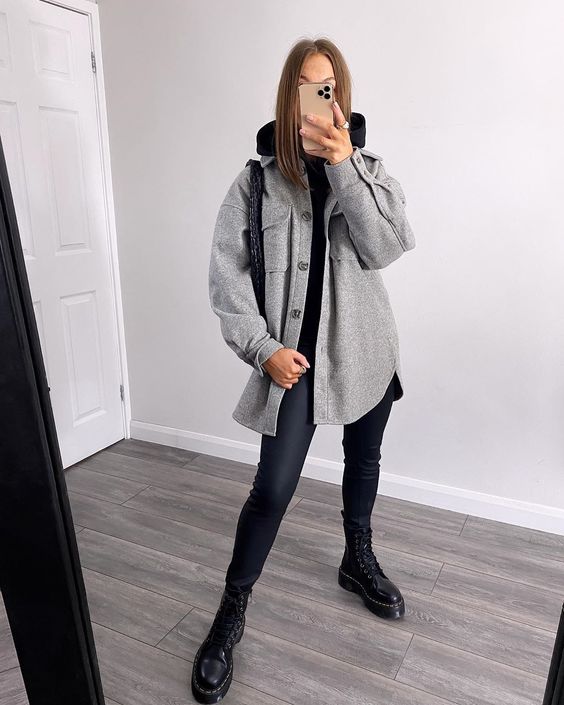 a black hodie and leggings, black combat boots, a grey shirt jacket and a black bag are a great combo for the transitional time