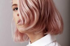 a delicate peachy rose gold bob with side bangs and a natural shine is a beautiful and modenr idea to try