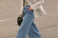 a grey t-shirt and an off-white blazer, blue wide leg jeans, nude heels and a black bag for work