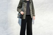 a grey t-shirt, black culottes, white sneakers, a green utility jacket, a black bag are a moody and cool look for spring