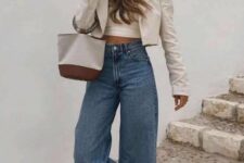 a neutral crop top, a cropped blazer, blue wide leg jeans, nude shoes and a small bag for spring and even summer