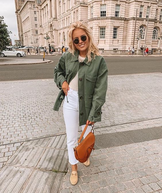 a neutral top, white cropped jeans, tan loafers, a green utility jacket and a brown saddle bag for every day