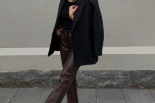 a simple and chic work outfit with a black top, a black blazer and boots, brown leather pants will never go out of style