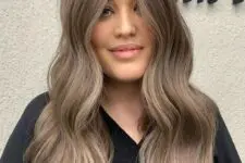 a soft mushroom brown shade with waves and lighter lowlights is a beautiful and delicate solution