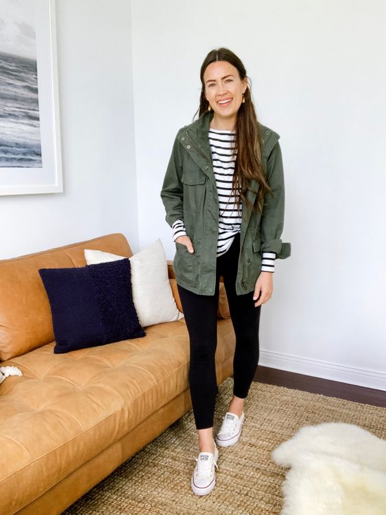 a striped long sleeve, black leggings, a green utility jacket and white sneakers are a lovely casual look