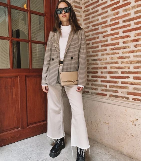 a white turtleneck and creamy cropped jeans, black combat boots, a greige plaid blazer and a tan bag for a lovely neutral look