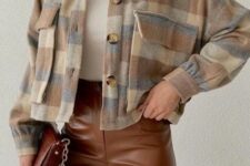 a white turtleneck, brown leather pants, a plaid cropped shirt jacket and a brown bag are a lovely look for spring
