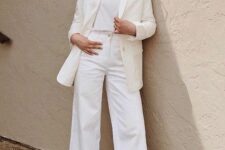 an all-white look with a t-shirt, cropped wide leg jeans, a blazer and snakeskin print booties is great for spring