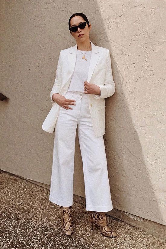 an all white look with a t shirt, cropped wide leg jeans, a blazer and snakeskin print booties is great for spring