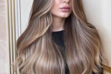 beautiful long and shiny mushroom brown hair with blonde lowlights and slight waves is a lovely idea to show all the beauty of your hair