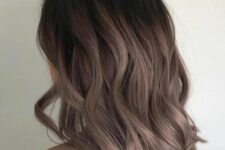 dark mushroom brown hair with a darker root and waves plus a long bob is a catchy and stylish idea to wear right not