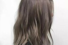 go fully into the ash trend with this muted metallic hue that still gets that cool factor from subtle balayage