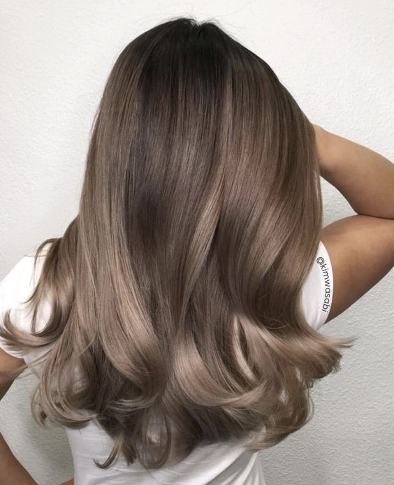 gorgeous shiny and wavy mushroom brown locks with a darker root and a slight ombre effect plus some waves is amazing