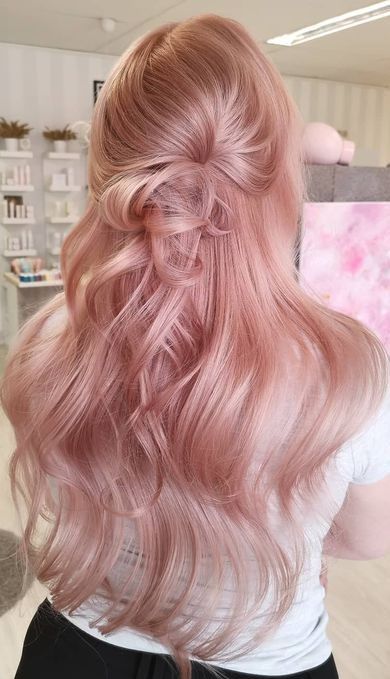 long and beautiful peachy rose gold hair with waves and a half updo is a lovely idea to show off your long locks