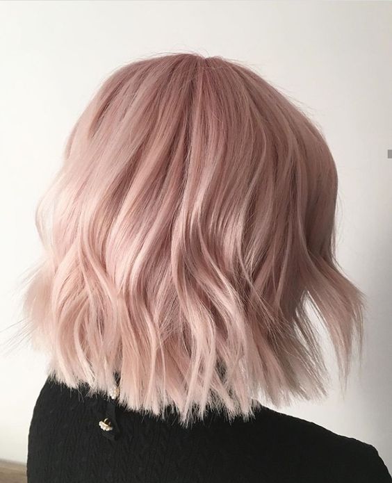 shoulder-length peachy rose blonde hair with waves is a stylish idea for anyone with light-colored or blonde hair